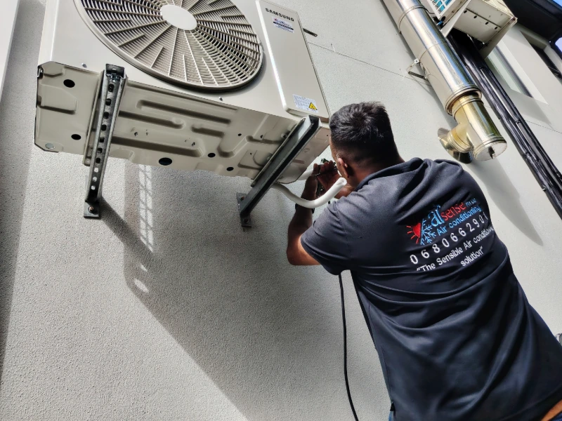 Air conditioning technician installing Samsung inverter in Constantia