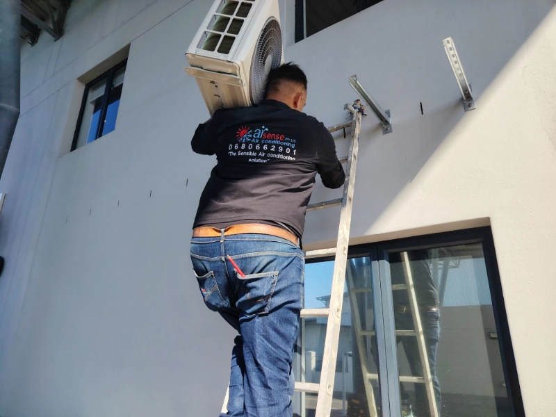 Securing outdoor compressor on wall