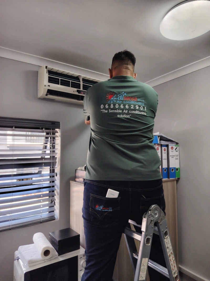 Airsense technician servicing air conditioning at CPUT Suites in District Six